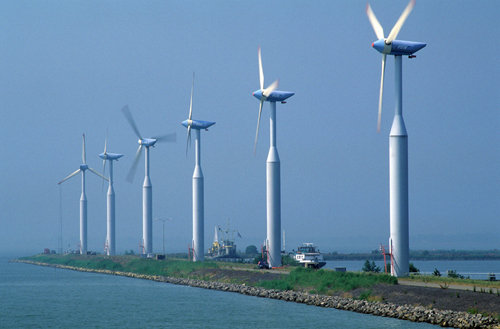 Netherlands, Friesland, wind mills near the dam